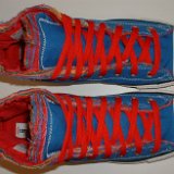 Multilayer High Top Chucks  Top view of royal blue multilayered high tops with red laces.