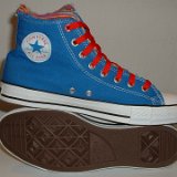 Multilayer High Top Chucks  Inside patch and outer sole views of royal blue multilayered high tops with red laces.