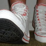 Multilayer High Top Chucks  Wearing red and white multilayer high tops, front view 2.