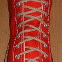 Narrow Round Shoelaces  Red high top with narrow tan laces.