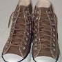 Narrow Round Shoelaces  Taupe high tops with brown shoelaces.