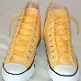 Narrow Round Shoelaces  Yellow high tops with narrow round gold shoelaces.