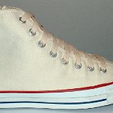 Natural White High Top Chucks  Outside view of a right natural white high top.