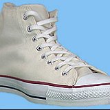 Natural White High Top Chucks  Angled front and outside view of a right natural white high top.