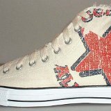 Natural (Unbleached) White High Top Chucks  Outside view of a left graphic star high top.