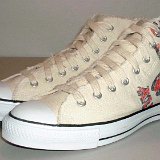 Natural (Unbleached) White High Top Chucks  Angled side view of graphic star high top chucks.