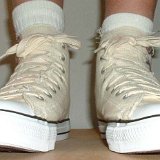Natural White High Top Chucks  Wearing graphic star high tops, front view.