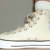 Natural (Unbleached) White High Top Chucks  Wearing a graphic star high top, inside patch view.