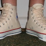 Natural White High Top Chucks  Wearing natural white high tops, angled front view.