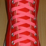 Classic Neon Shoelaces  Red high top with neon pink laces.