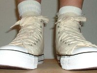 Off White Graphic Star High Top Chucks  Wearing a graphic star high top, front view.