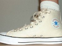 Off White Graphic Star High Top Chucks  Wearing a graphic star high top, inside patch view.