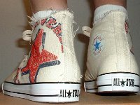 Off White Graphic Star High Top Chucks  Wearing graphic star high tops, rear view.
