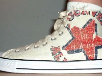 Off White Graphic Star High Top Chucks  Wearing a graphic star high top, outside view.