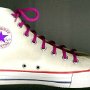 Optical White High Top Chucks  Left optical white high top with narrow magenta laces, inside patch view.