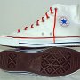 Optical White High Top Chucks  Inside patch and sole views of optical white high tops with narrow red laces.