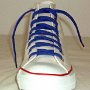 Optical White High Top Chucks  Front view of a left optical white high top with royal blue laces.