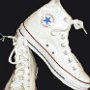 Optical White High Top Chucks  Front and angled inside patch view of optical white high tops.