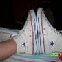 Optical White High Top Chucks  Wearing paired optical white high top chucks.