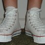 Optical White High Top Chucks  Wearing new optical white high tops, front view.