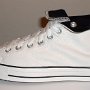 Optical White High Top Chucks  Outside view of a left rolled down optical white and black high top.