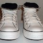 Optical White High Top Chucks  Front view of rolled down optical white and black high tops.