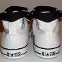Optical White High Top Chucks  Rear view of rolled down optical white and black high tops.