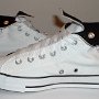 Optical White High Top Chucks  Inside patch views of rolled down optical white and black high tops.