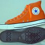 Orange Chucks  Orange flame high tops with orange laces, right inside and sole views.