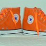 Orange Chucks  Orange flame high tops with orange laces, inside patch view.