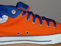 Orange and Royal Foldover High Top Chucks  Inside patch view of a left orange and royal blue high top rolled down to the seventh eyelet.
