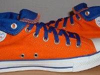 Orange and Royal Foldover High Top Chucks  Inside patch views of orange and royal blue high tops rolled down to the seventh eyelet.