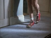 The Paperboy  Closeup of Johnny's red high top chucks in the hall.