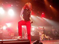 Paramore  Hayley Williams in concert wearing a pair of red high top chucks, shot 5.