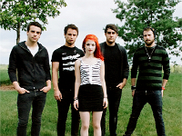 Paramore  Posed band photo. Taylor York is wearing a pair of black Chuck Taylors with black shoelaces.