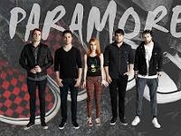 Paramore  Poster shot of the band. Taylor York is wearing a pair of black Chuck Taylors; there are also chucks in the background.