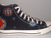 Patchwork High Top and Low Cut Chucks  Outside view of a right black high top.