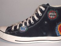 Patchwork High Top and Low Cut Chucks  Outside view of a left black high top.