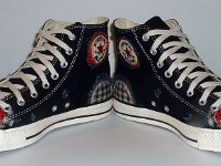 Patchwork High Top and Low Cut Chucks  Angled front view of a pair of black high tops.
