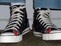 Patchwork High Top and Low Cut Chucks  Wearing black patches high tops, front view.