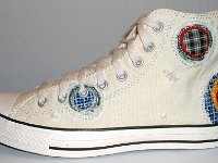 Patchwork High Top and Low Cut Chucks  Outside view of a left natural white high top.