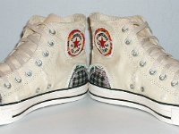 Patchwork High Top and Low Cut Chucks  Angled front view of a pair of natural white high tops.