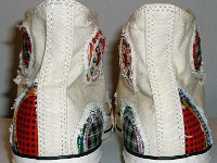 Patchwork High Top and Low Cut Chucks  Rear view of a pair of natural white high tops.