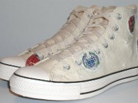 Patchwork High Top and Low Cut Chucks  Angled side view of a pair of natural white high tops.