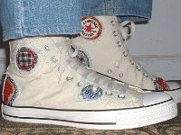 Patchwork High Top and Low Cut Chucks  Wearing white patches high tops, side view.