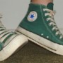 Pine Green HIgh Top Chucks  Lounging in made in USA pine green high top chucks, angled right side views.