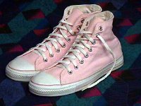 Pink High Top and Low Cut Chucks  Light pink high tops, with pink piping, angled outside view.