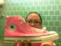 Pink High Top and Low Cut Chucks  Girl with left pink high top chuck.