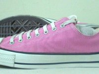 Pink High Top and Low Cut Chucks  Side view of pink lwo cut chucks.