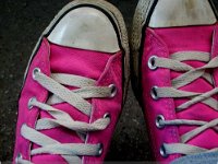 Pink High Top and Low Cut Chucks  Wearing neon pink chucks, top view.